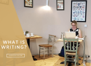 Dawn A Denton writing in a cafe in Frome, Somerset