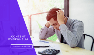 a man overhelmed at his computer with his head in his hands