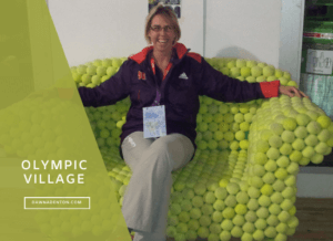 Dawn sitting on a bench made of tennis balls in the Olympic Village