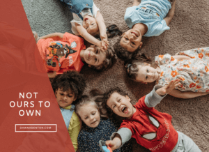 children lying in a circle having fun and laughing