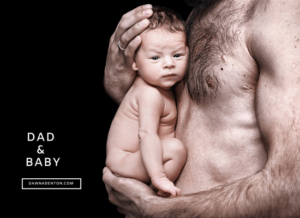 a father with his young baby in his arms