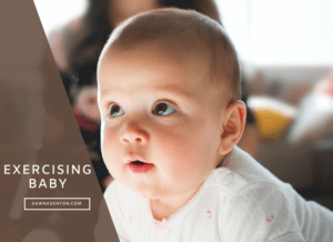 a baby lifting himself on a the floor