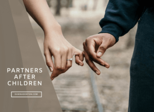 a man and woman linking pinkie fingers